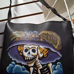 Handcrafted Black Leather Bag with Artistic Design